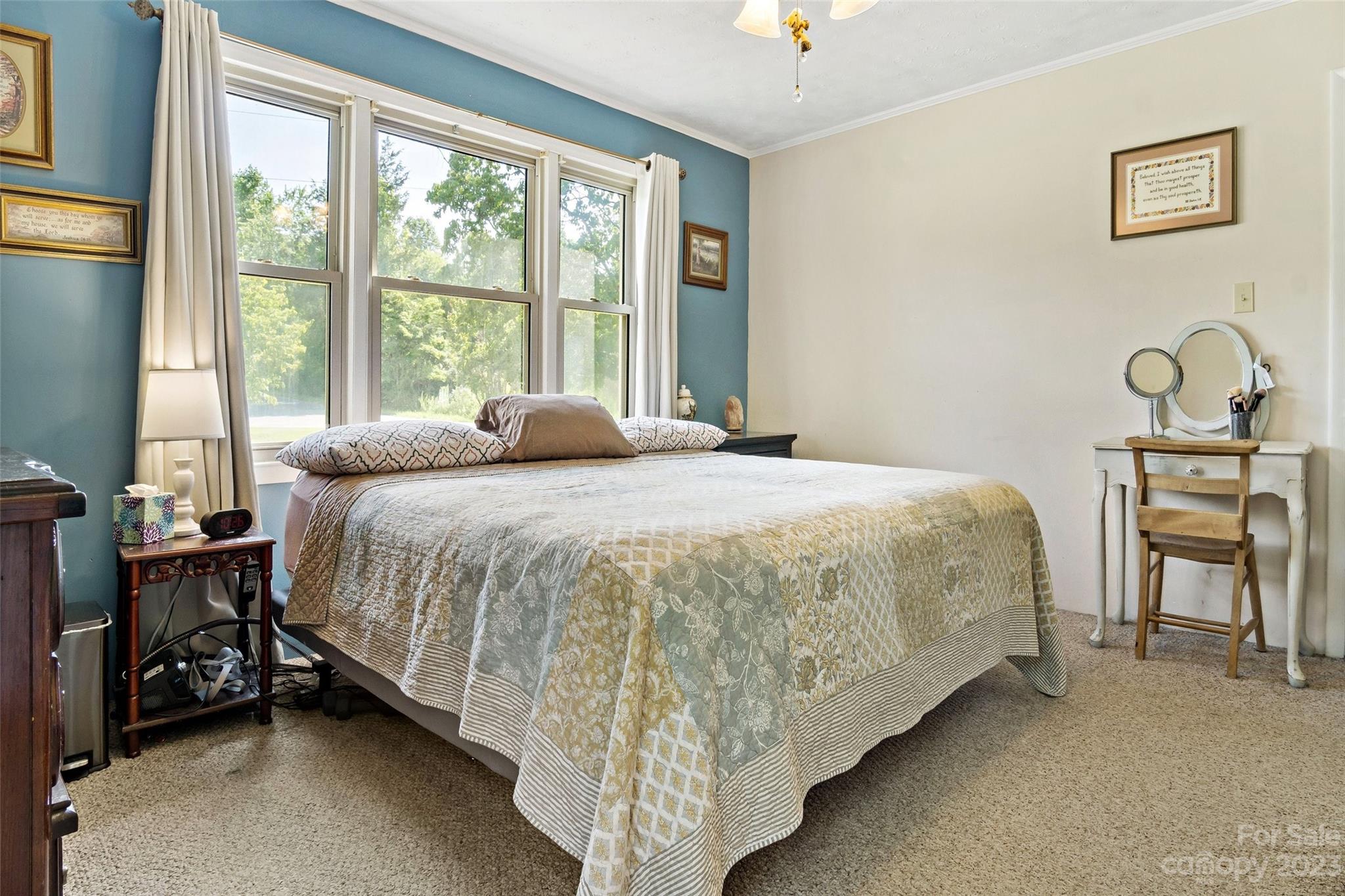 5232 Bat Cave Road Old Fort, NC 28762 - Photo 28 of 32 a bed sitting in a bedroom next to a window