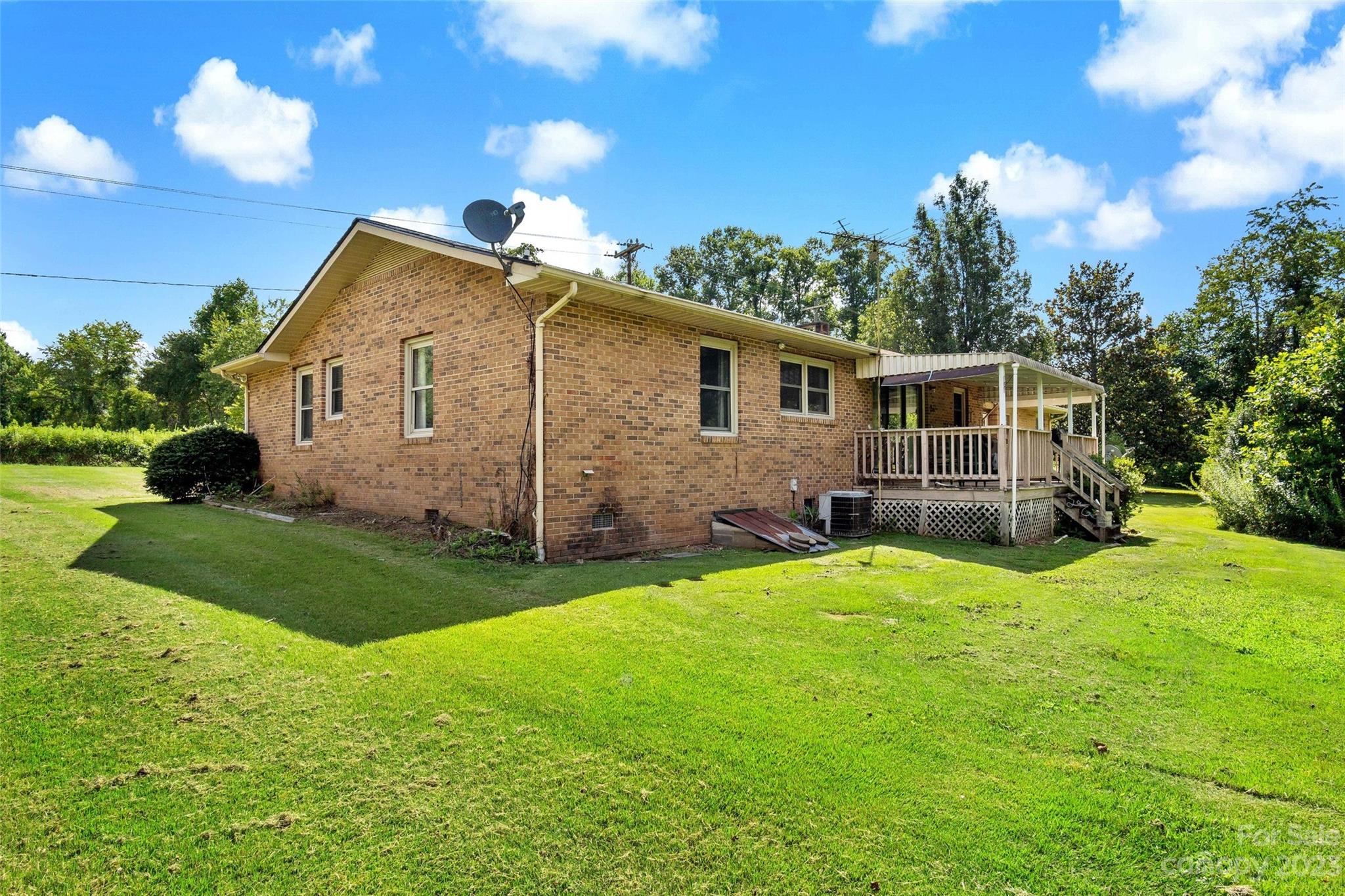 5232 Bat Cave Road Old Fort, NC 28762 - Photo 5 of 32 a view of a house with a yard