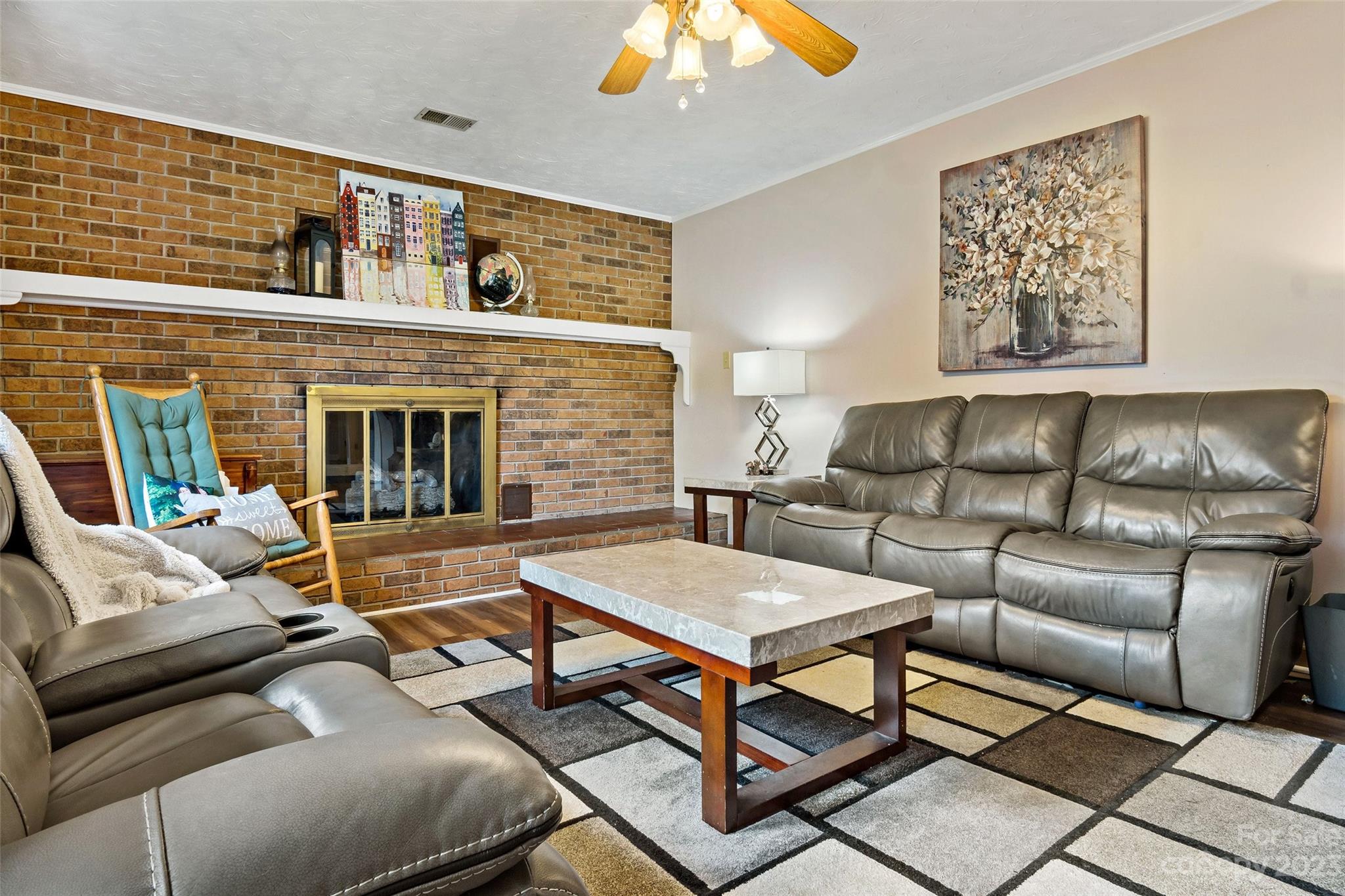 5232 Bat Cave Road Old Fort, NC 28762 - Photo 7 of 32 a living room with furniture and a fireplace