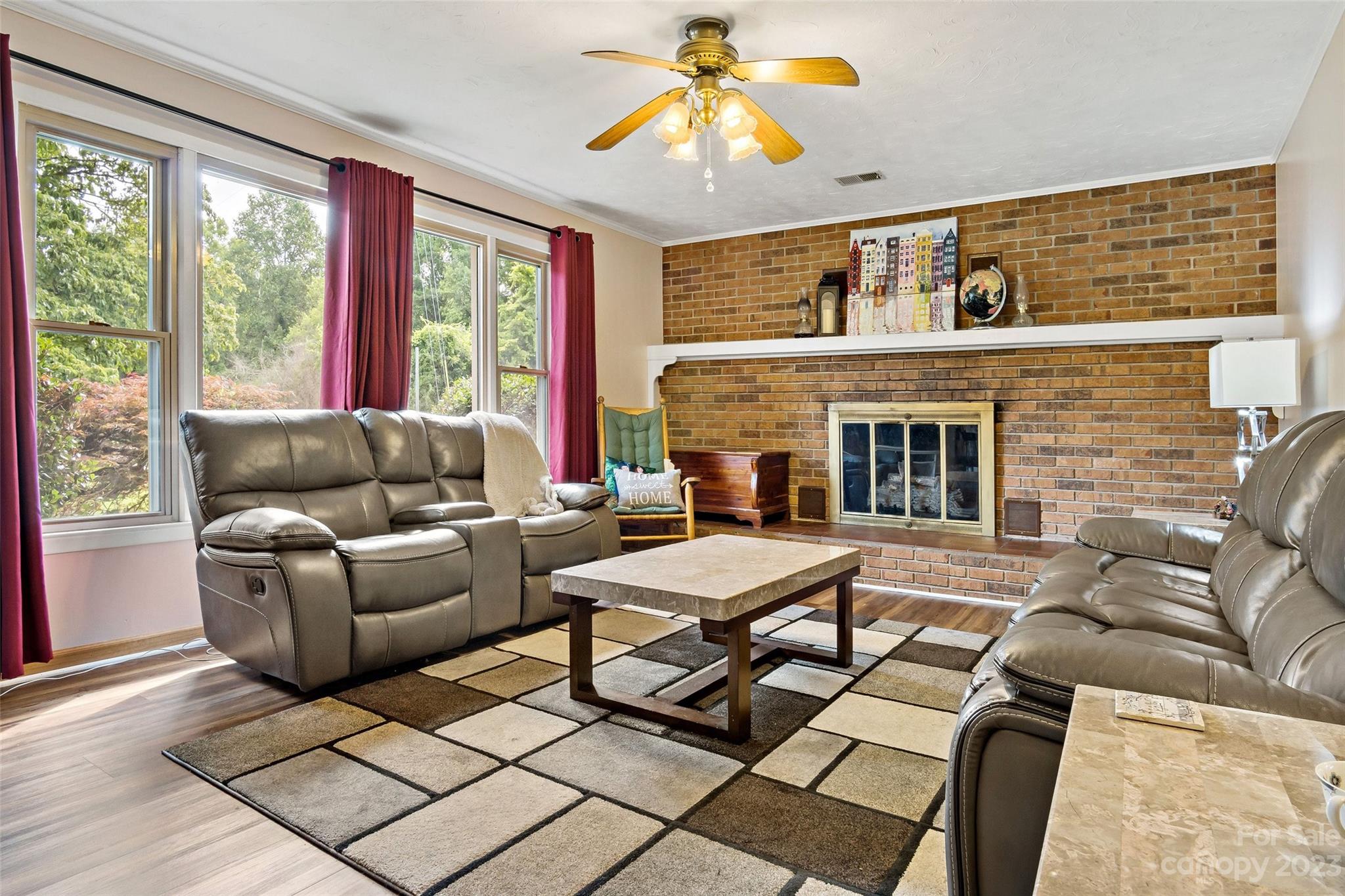 5232 Bat Cave Road Old Fort, NC 28762 - Photo 8 of 32 a living room with furniture and a fireplace