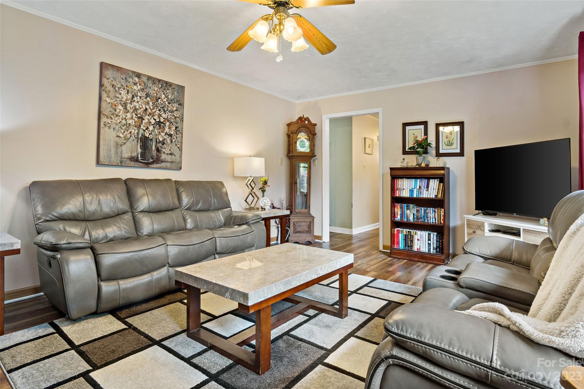 5232 Bat Cave Road Old Fort, NC 28762 - Photo 10 of 32 a living room with furniture and a flat screen tv