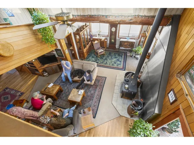 a living room with furniture a window and a table