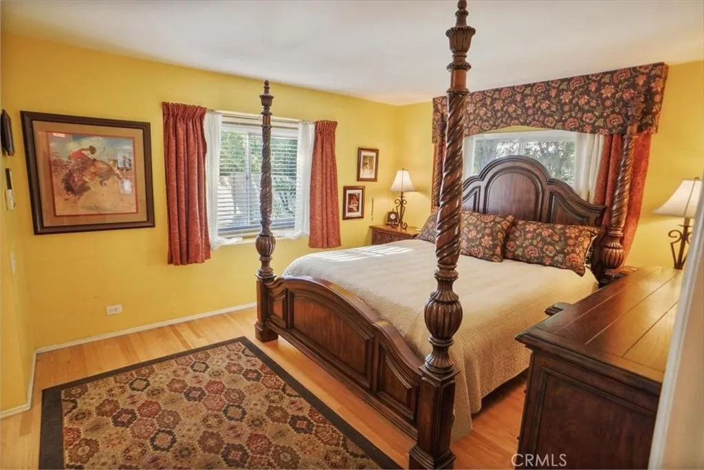 8636 Delco Avenue Winnetka, CA 91306 - Photo 11 of 20 a bed sitting in a bedroom next to a window