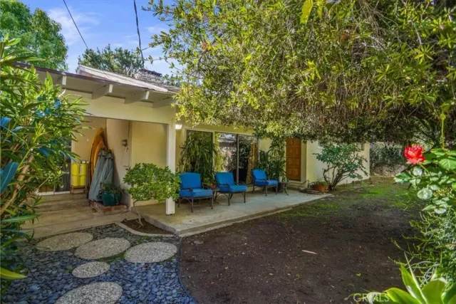 a front view of a house with garden