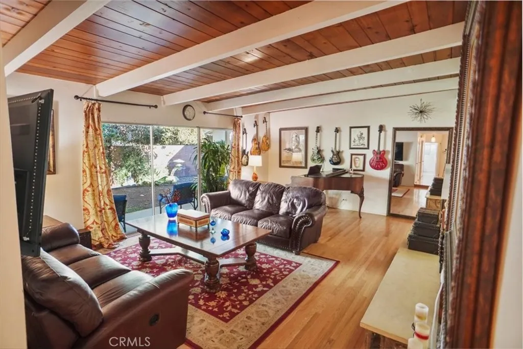 8636 Delco Avenue Winnetka, CA 91306 - Photo 4 of 20 a living room with furniture and a large window