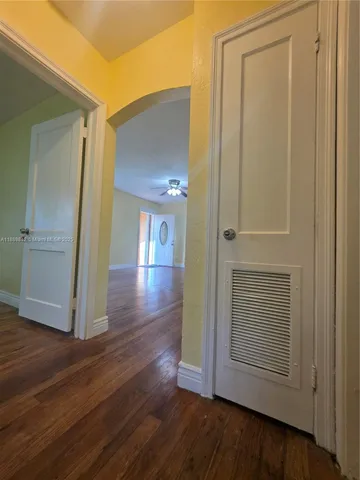 an entryway with wooden floor