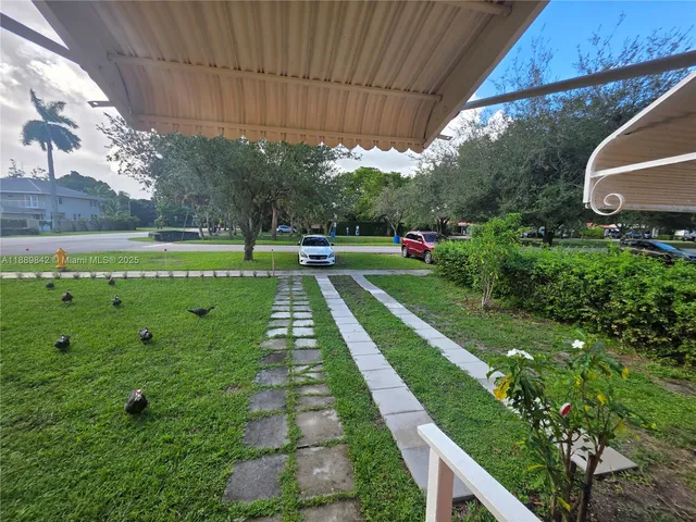 a view of a backyard with garden