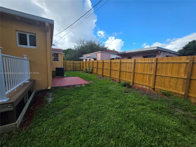 a view of a backyard with a garden