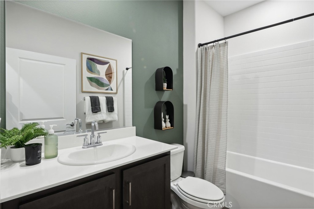 83241 Thrush Way Indio, CA 92201 - Photo 17 of 33 a bathroom with a sink toilet and shower