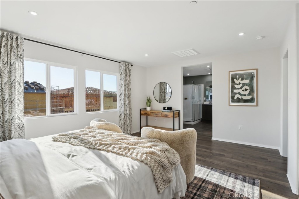 83241 Thrush Way Indio, CA 92201 - Photo 24 of 33 a bedroom with a large bed and a large window
