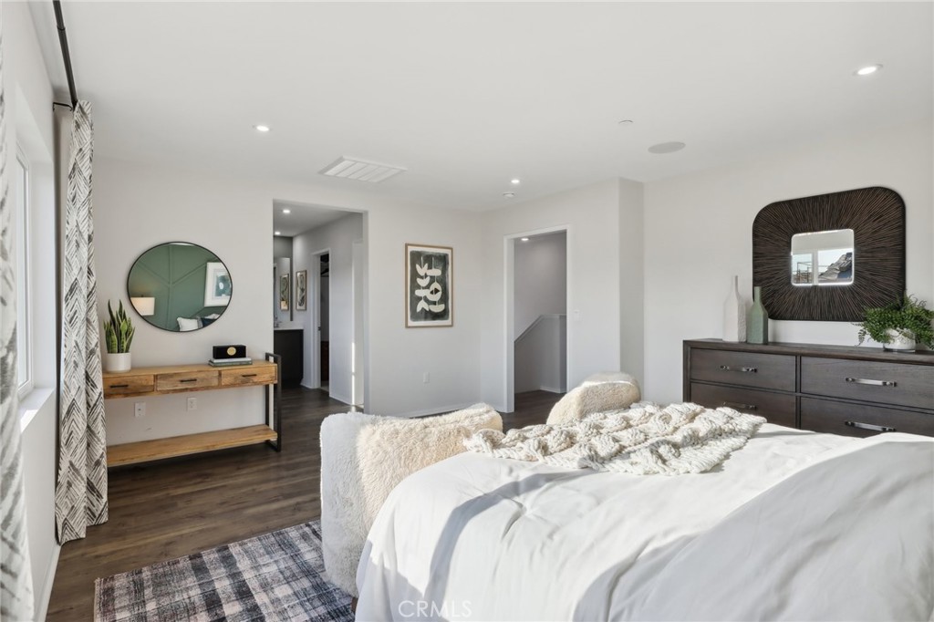 83241 Thrush Way Indio, CA 92201 - Photo 25 of 33 a bedroom with a bed and a mirror on dresser