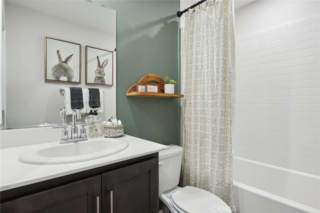83241 Thrush Way Indio, CA 92201 - Photo 29 of 33 a bathroom with a sink toilet and shower