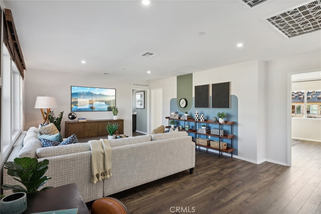 83241 Thrush Way Indio, CA 92201 - Photo 6 of 33 a living room with furniture and a flat screen tv