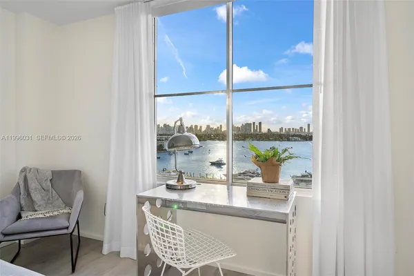 a dining room with a large window and table