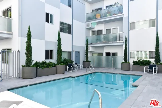 a view of a building with potted plants