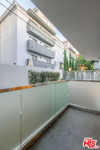 a room with a window and flowerpot