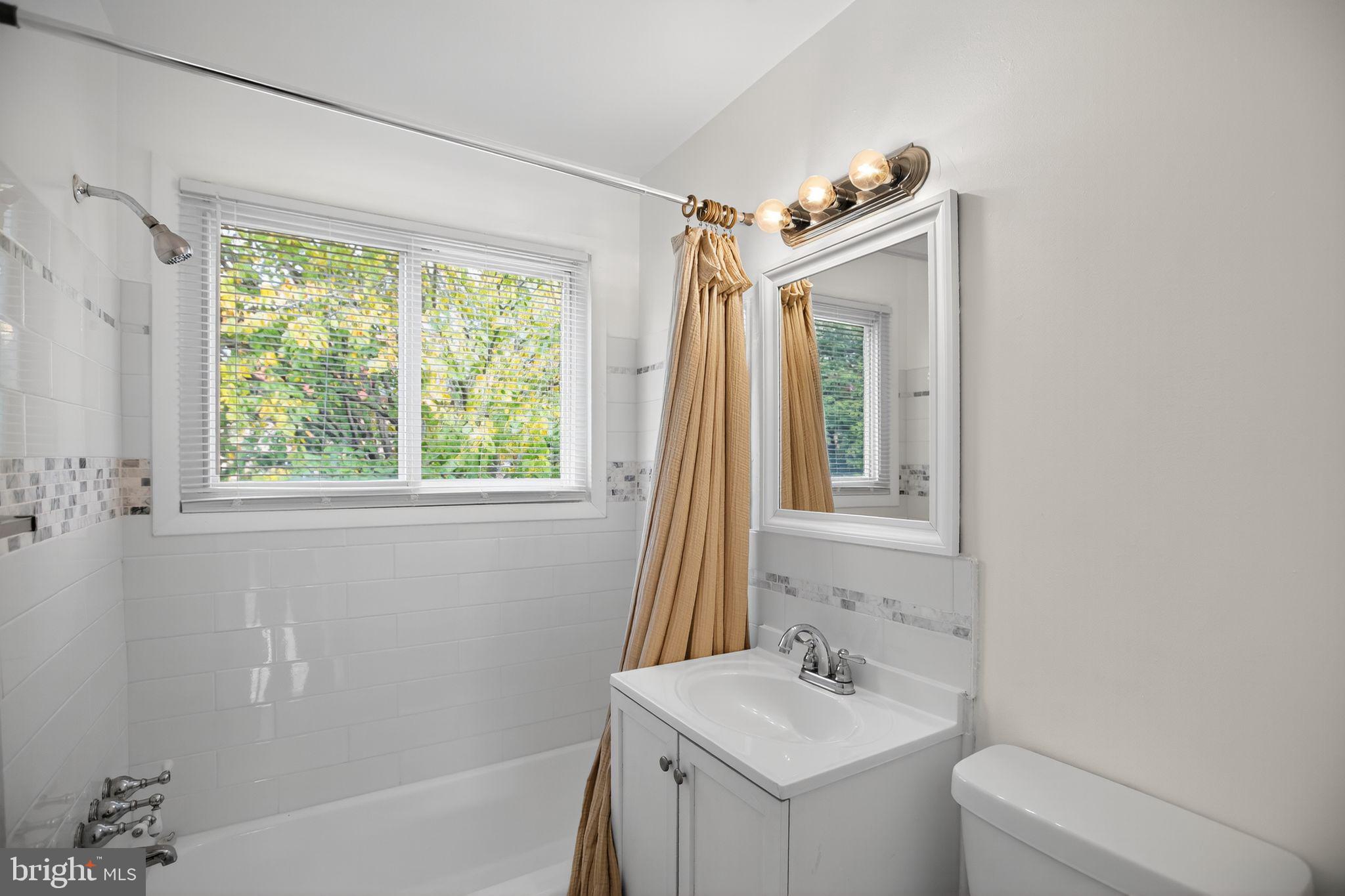 1432 41st Street Southeast Washington, DC 20020 - Photo 15 of 29 a bathroom with a sink a toilet and a bathtub