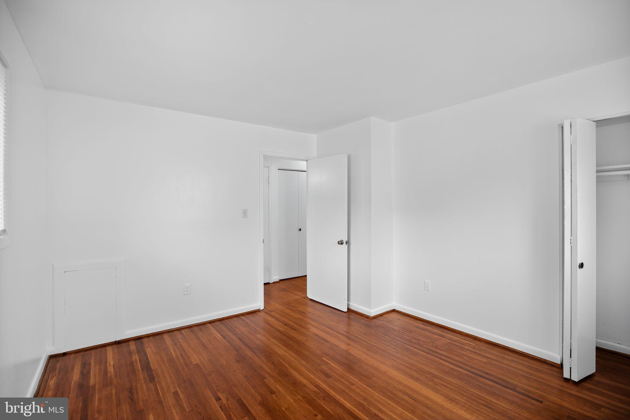 1432 41st Street Southeast Washington, DC 20020 - Photo 19 of 29 a view of an empty room with wooden floor and closet