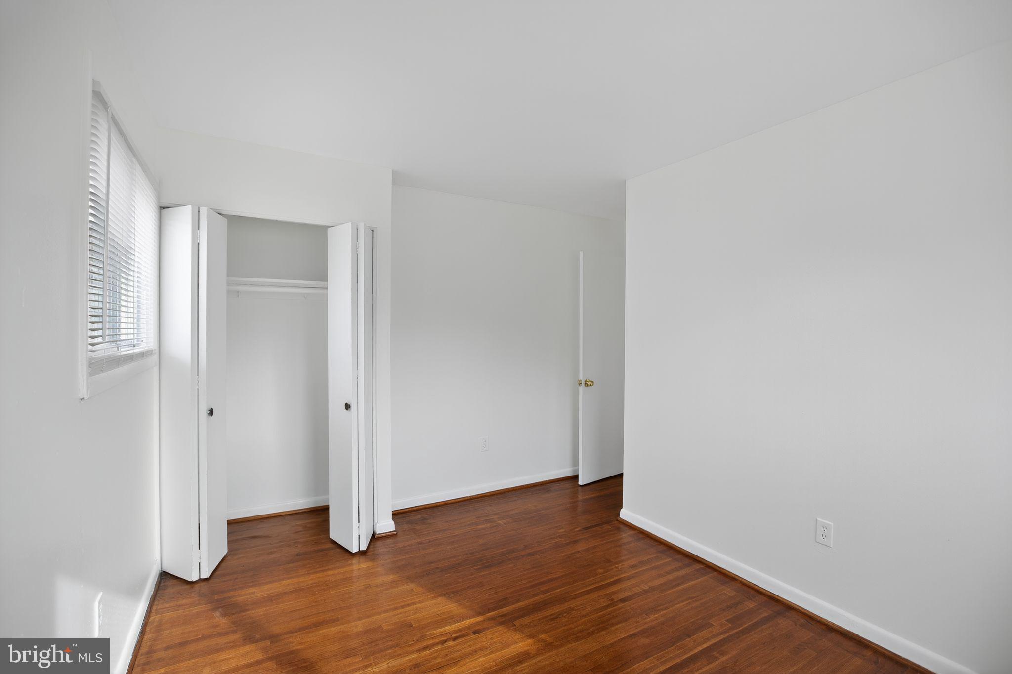 1432 41st Street Southeast Washington, DC 20020 - Photo 20 of 29 a view of an empty room with wooden floor and closet