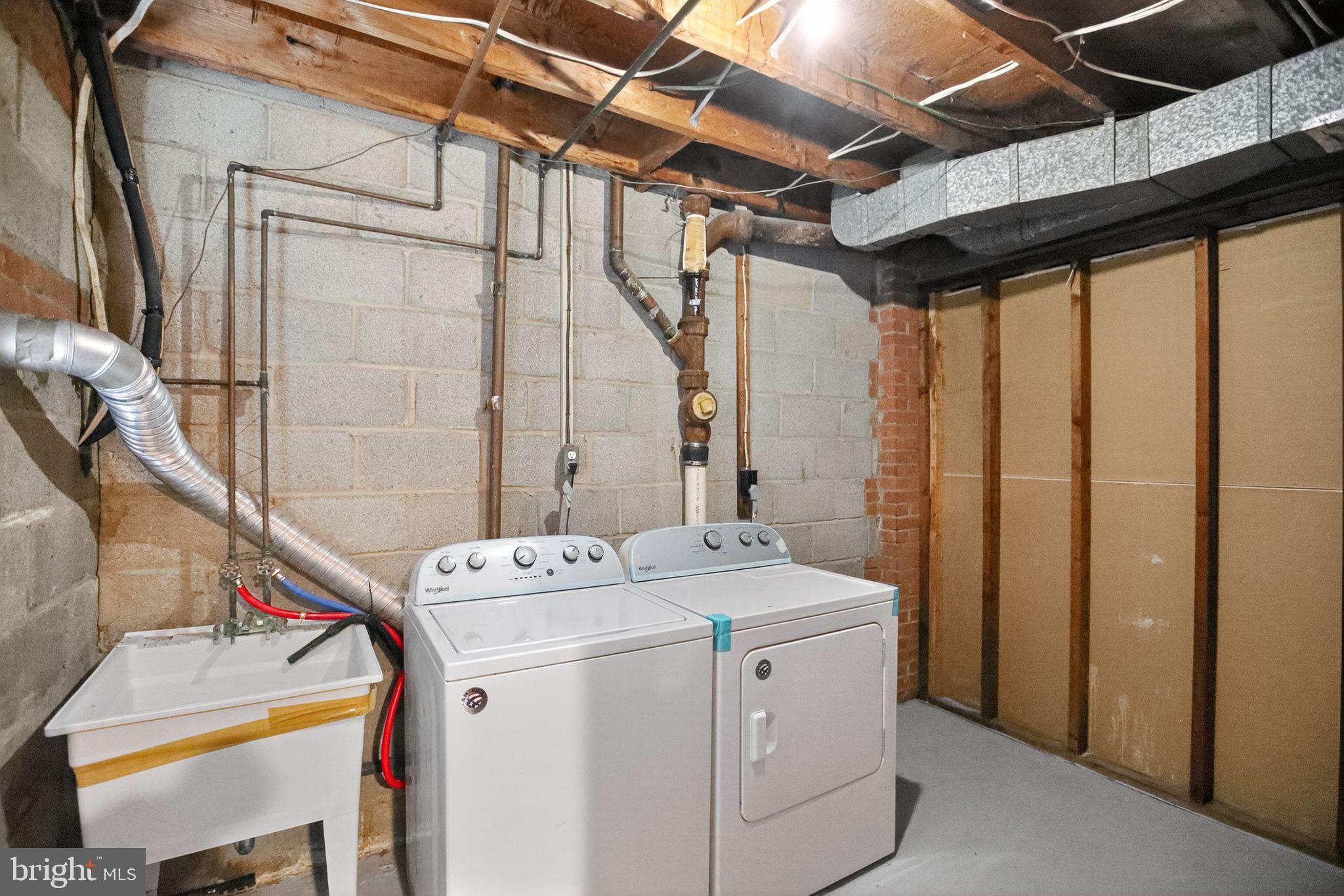 1432 41st Street Southeast Washington, DC 20020 - Photo 26 of 29 a utility room with dryer and washer