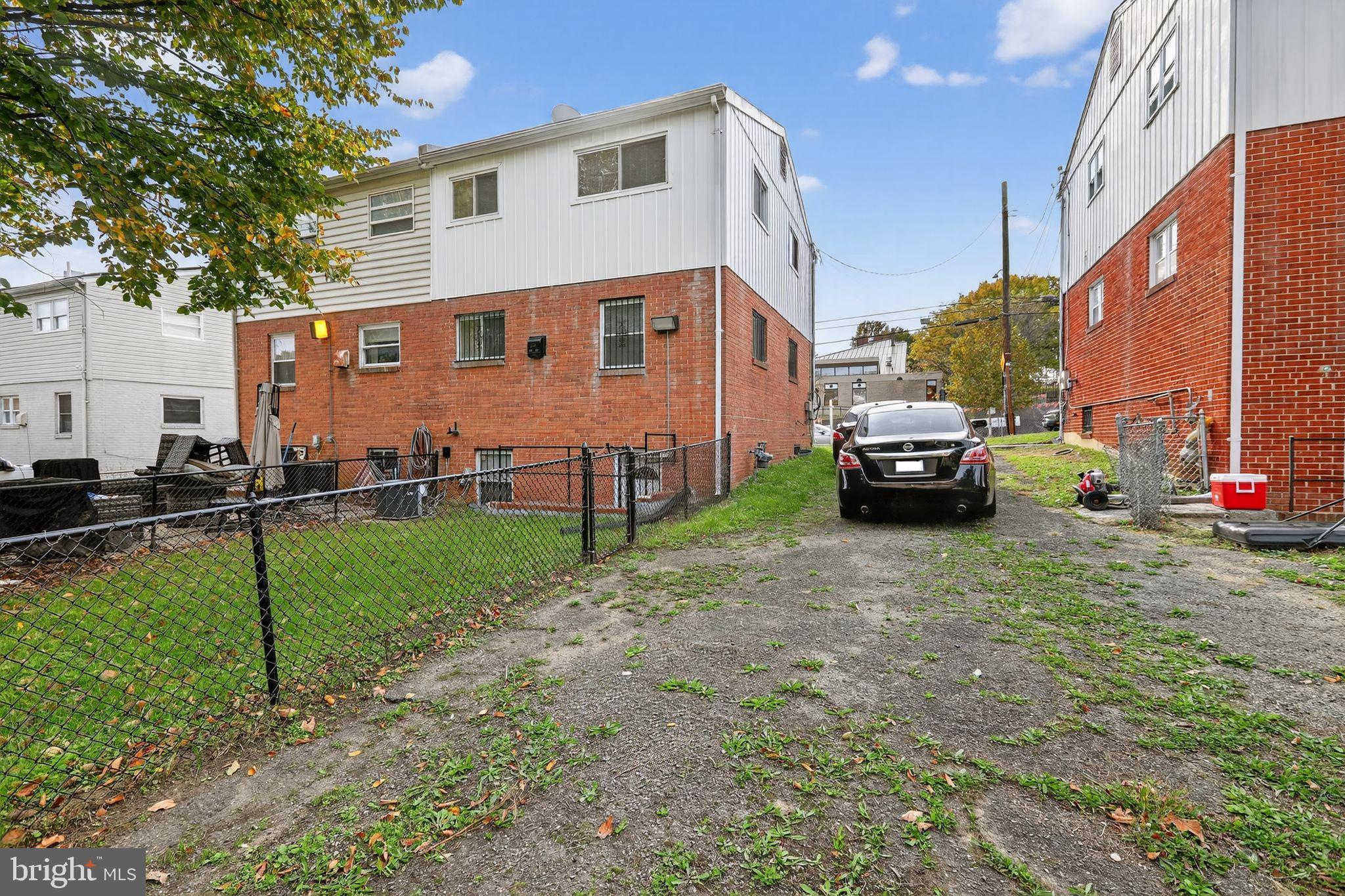1432 41st Street Southeast Washington, DC 20020 - Photo 29 of 29 a car parked in front of a white house