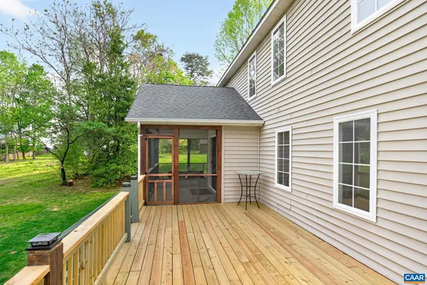 a view of house with backyard and garden