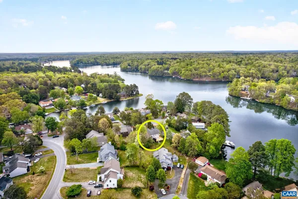 an aerial view of a house with a yard