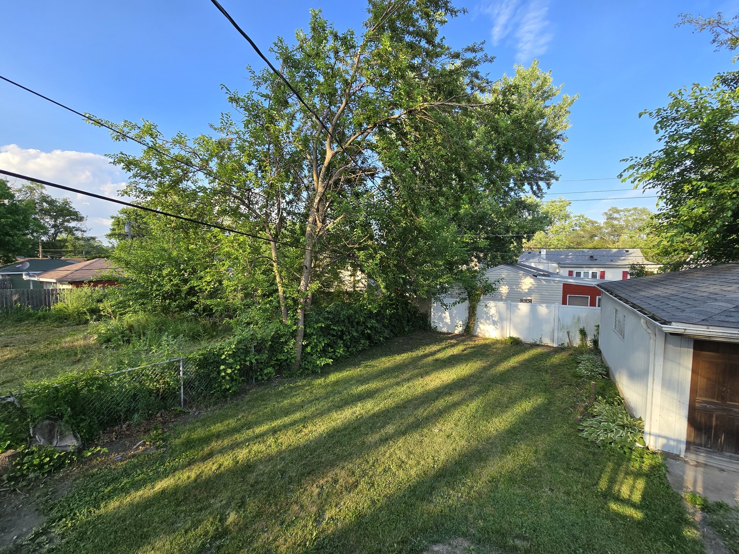 15035 Harding Avenue Midlothian, IL 60445 - Photo 32 of 32 a view of a backyard with a garden
