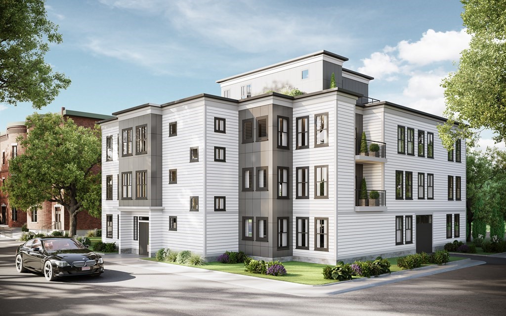 173 Magnolia Street, Unit 5 Boston, MA 02125 - Photo 1 of 1 a front view of a building with lot of cars and trees