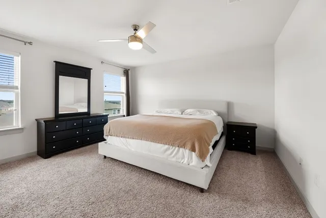 a view of a hallway with wooden shelves