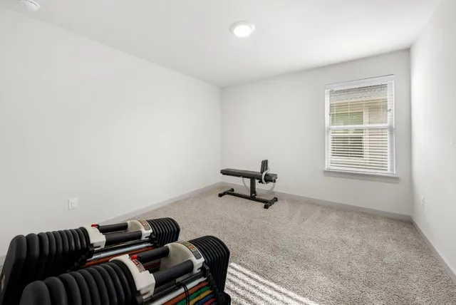 a bedroom with a bed and a table