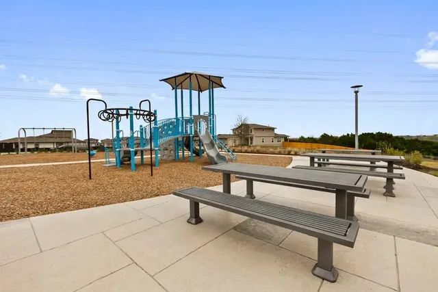 a view of a swimming pool with a patio
