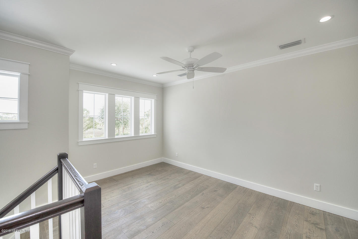 14712 Stacey Road Jacksonville, FL 32250 - Photo 20 of 26 a view of a livingroom with a ceiling fan and window