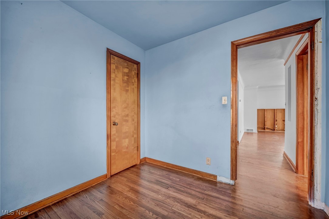 14750 Schreiber Road Maple Heights, OH 44137 - Photo 22 of 44 Unfurnished room featuring wood finished floors and baseboards