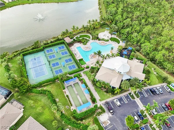 an aerial view of residential house with outdoor space and parking