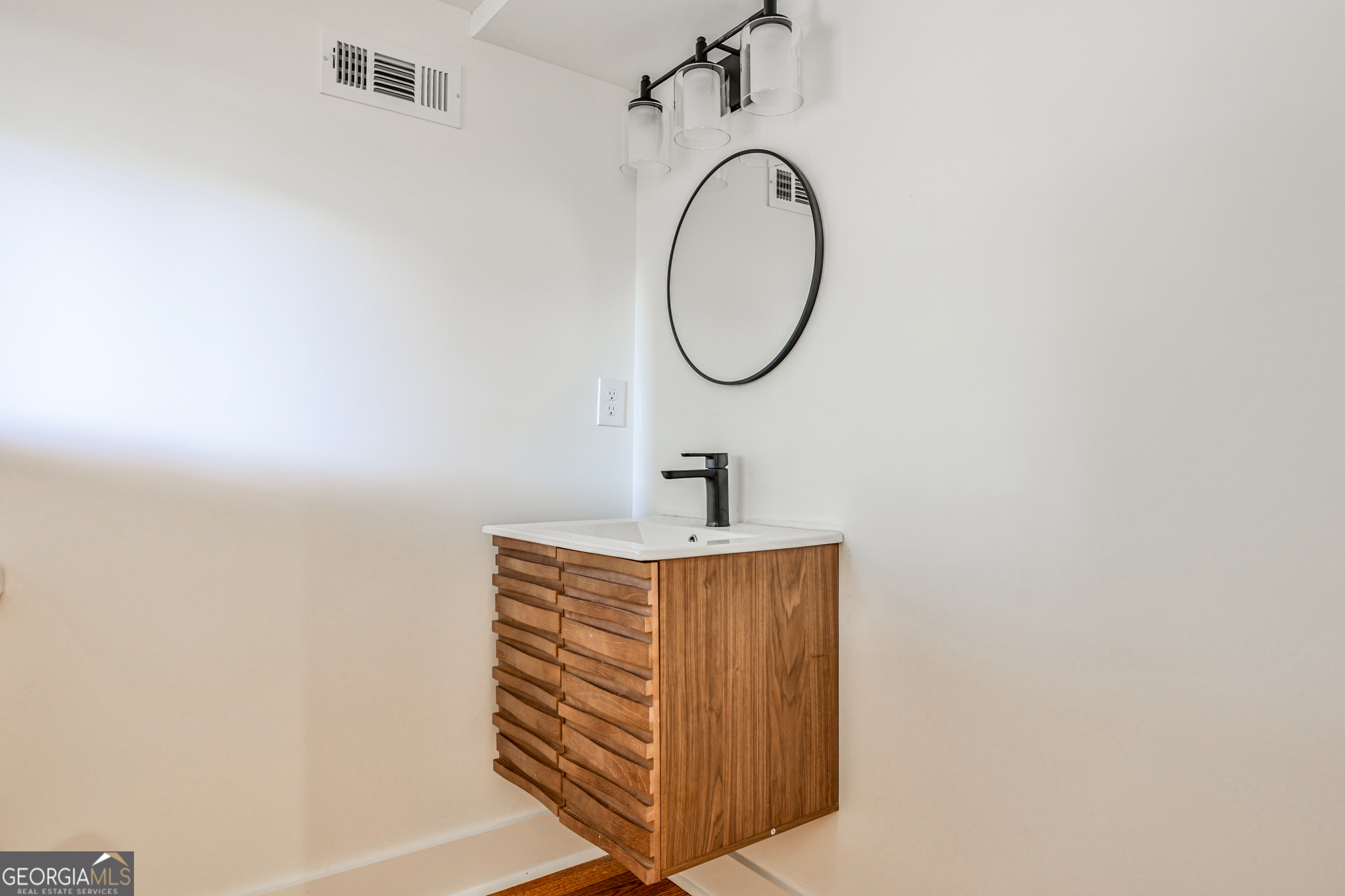 3029 Charlbury Place Avondale Estates, GA 30002 - Photo 11 of 27 a bathroom with a sink and a mirror