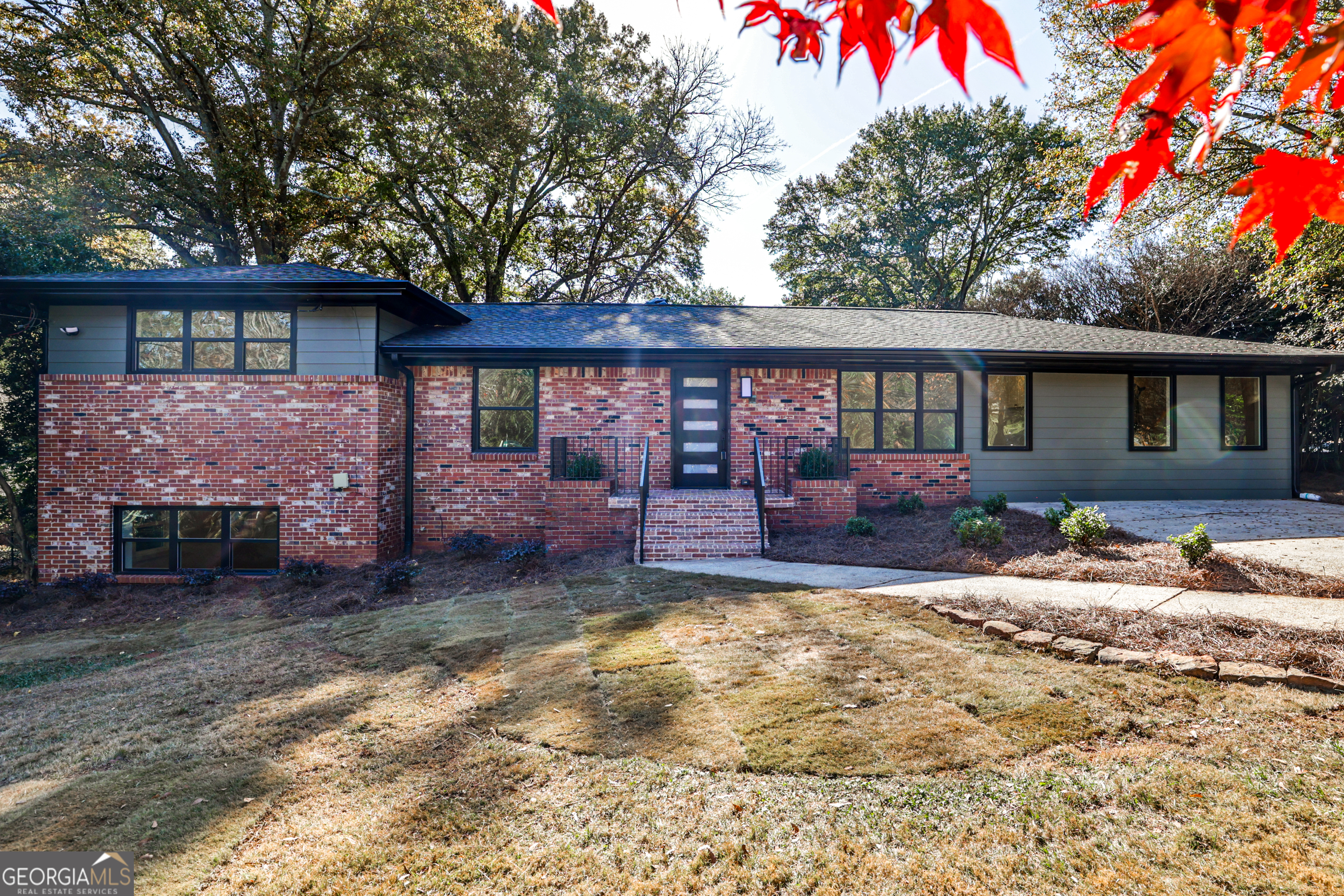 3029 Charlbury Place Avondale Estates, GA 30002 - Photo 13 of 27 a front view of a house with a yard and garage