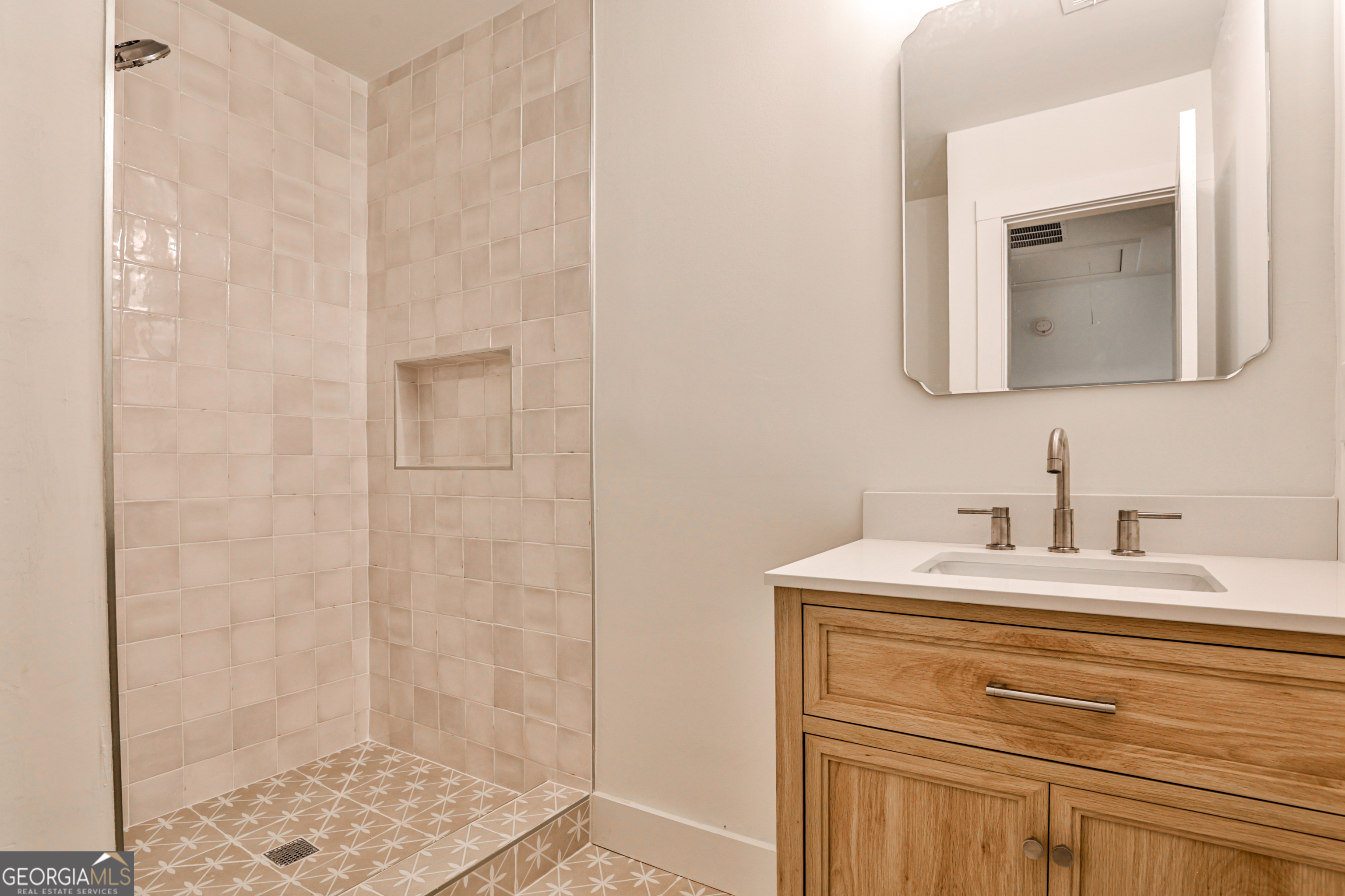 3029 Charlbury Place Avondale Estates, GA 30002 - Photo 21 of 27 a bathroom with a sink and a mirror