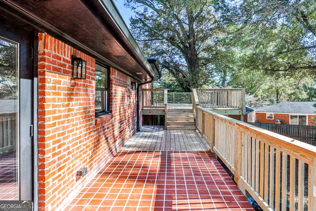 a view of balcony with wooden floor