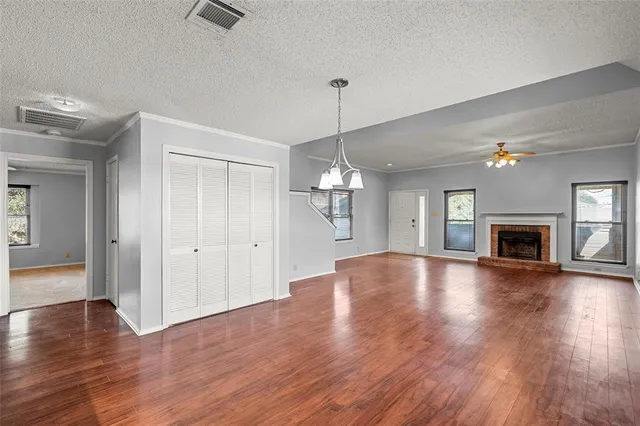 a dining room with furniture a window and wooden floor