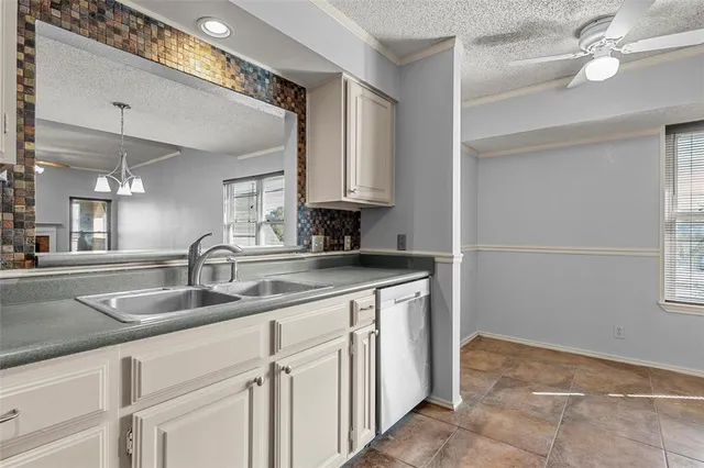 a kitchen with appliances and cabinets