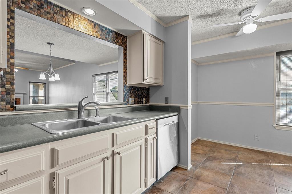 156 Pleasant Grove Lane, Unit 5 Waco, TX 76712 - Photo 15 of 37 a kitchen with cabinets and window