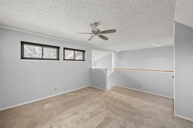 a view of a workspace with a table and chair in a room