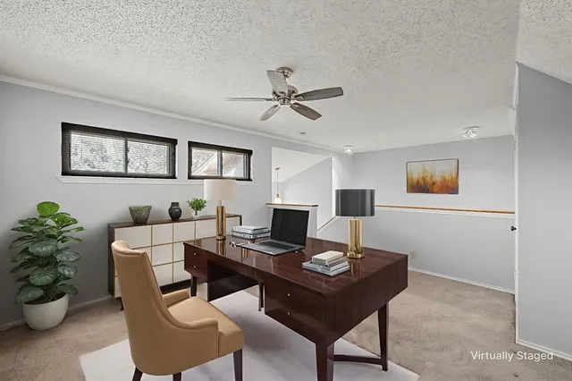 a bathroom with a toilet sink vanity and mirror