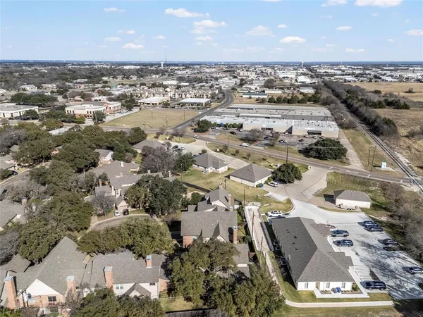 an outdoor space with swimming pool and furniture