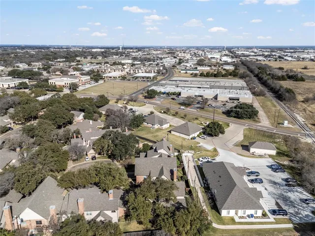 an outdoor space with swimming pool and furniture