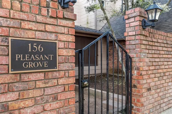 a view of a brick house with wooden floor