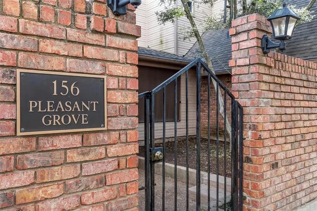 a view of a brick house with wooden floor
