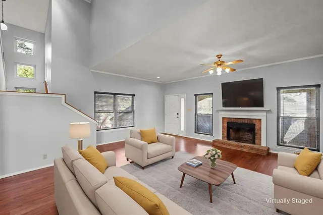 a living room with a fireplace and a window