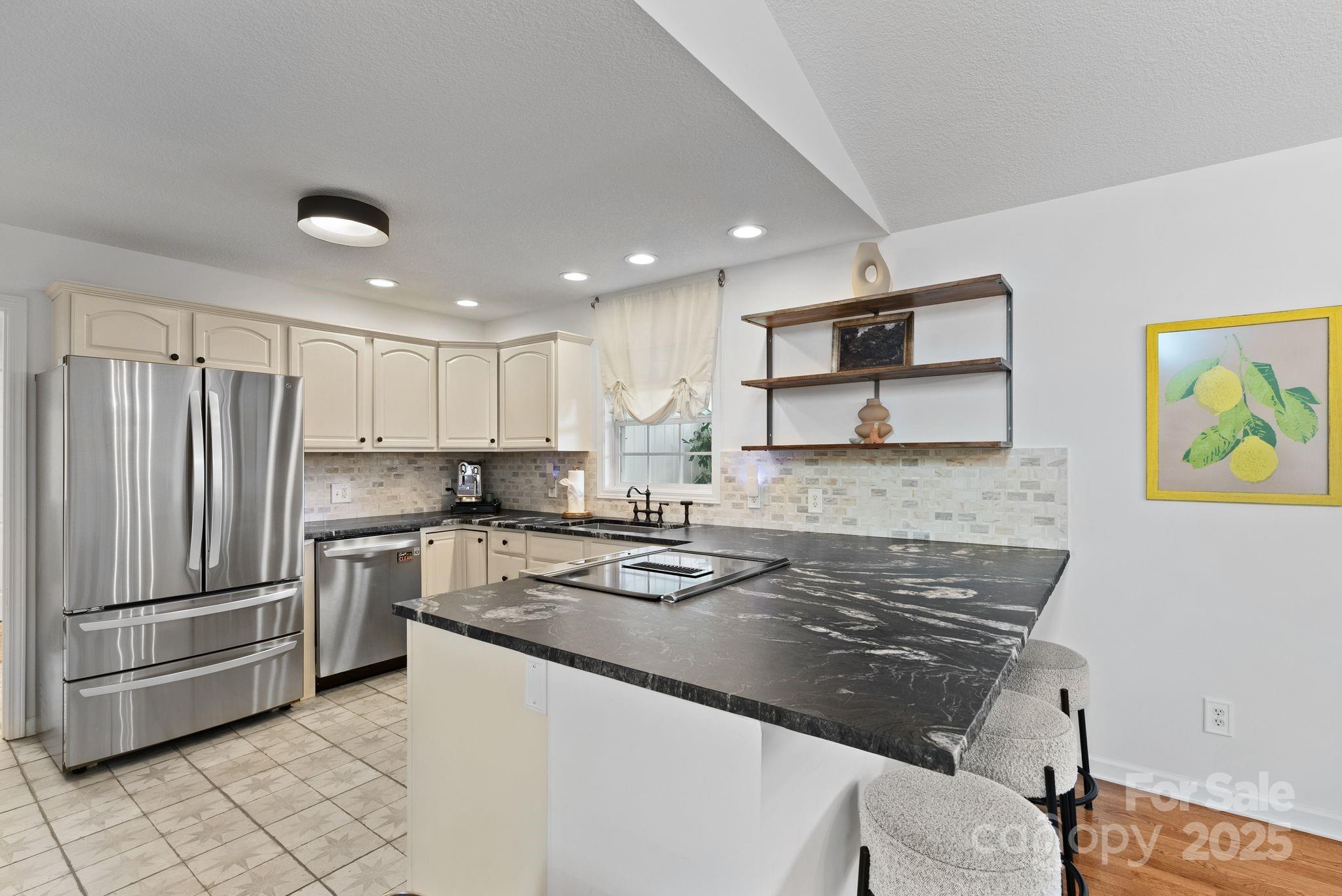 6 Sayles Town Road Fairview, NC 28730 - Photo 11 of 43 a kitchen with refrigerator and cabinets